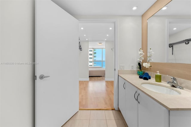 bathroom with tile patterned flooring and vanity