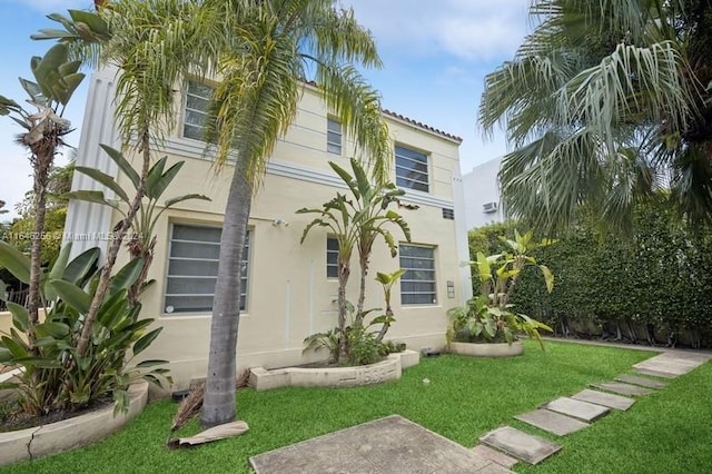 view of front of property with a front lawn