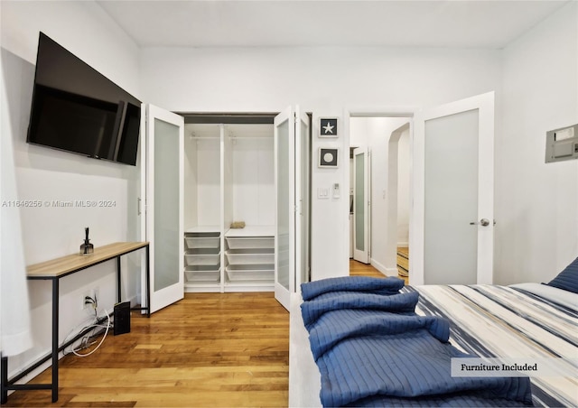 bedroom with a closet and light wood-type flooring