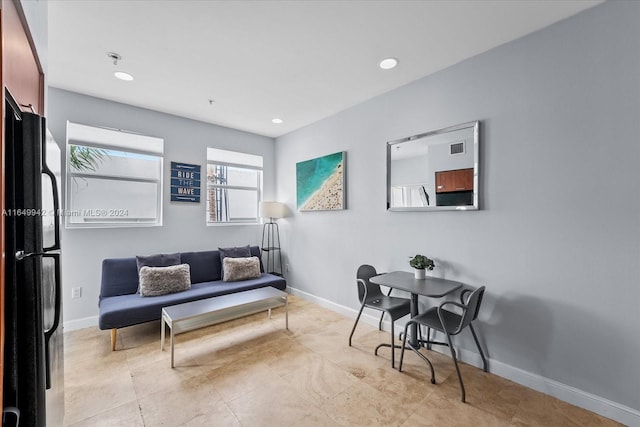 sitting room featuring light tile patterned flooring