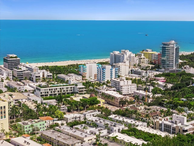 drone / aerial view featuring a view of the beach and a water view