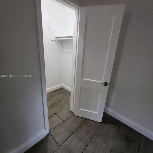 spacious closet featuring tile patterned floors