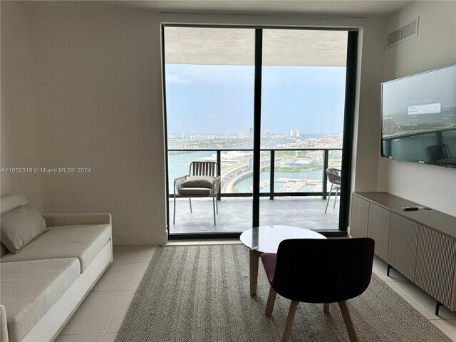 601 NE 1st Ave Unit 2616, Miami, FL 33132 - living area featuring floor to ceiling windows, plenty of natural light, and light tile patterned flooring