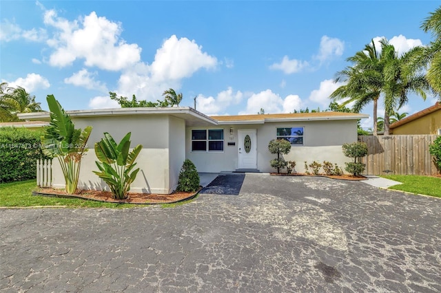 single story home featuring a patio