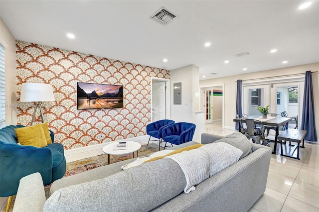 living room featuring french doors, light tile patterned floors, and electric panel