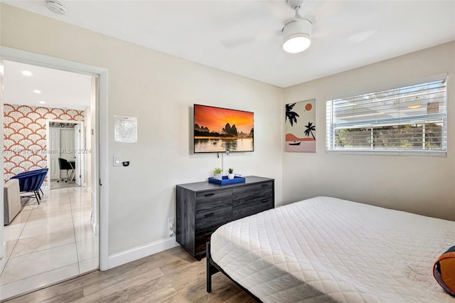 bedroom featuring ceiling fan and light hardwood / wood-style floors