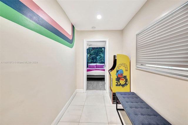 hallway with light tile patterned floors