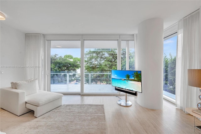 sitting room with floor to ceiling windows