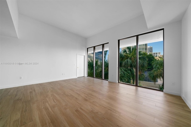 unfurnished room featuring light hardwood / wood-style floors