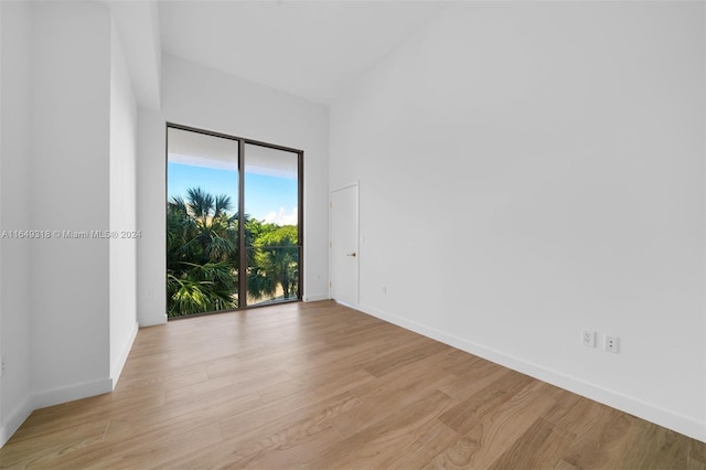 spare room with light wood-type flooring