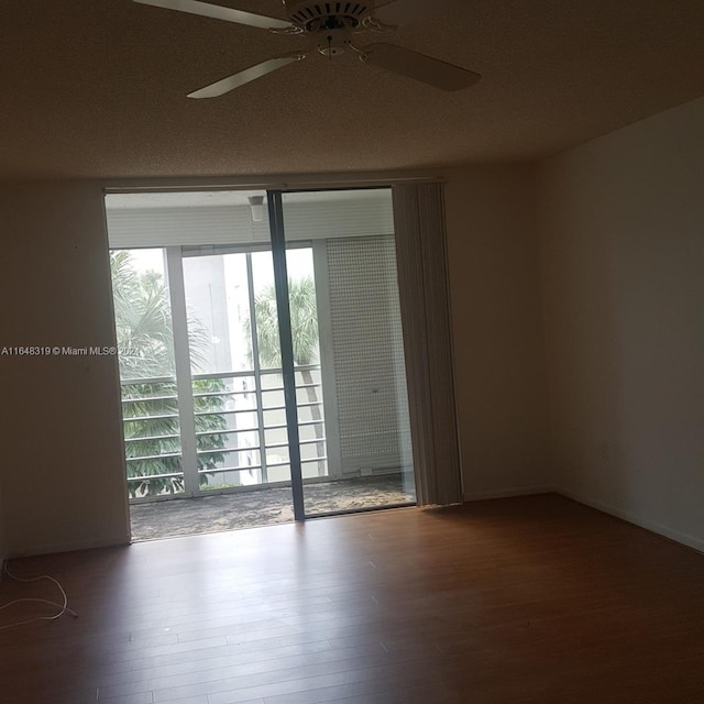 unfurnished room featuring a textured ceiling, ceiling fan, and hardwood / wood-style floors