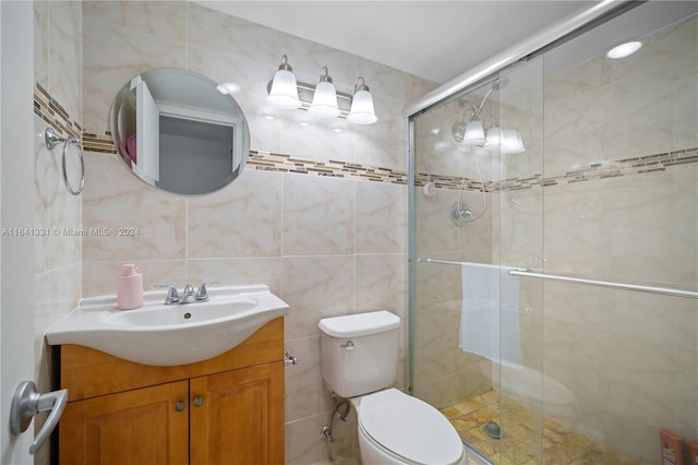 bathroom featuring vanity, an enclosed shower, tasteful backsplash, tile walls, and toilet