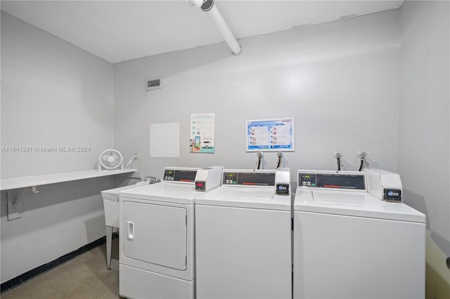 washroom featuring washer and dryer and light tile patterned floors