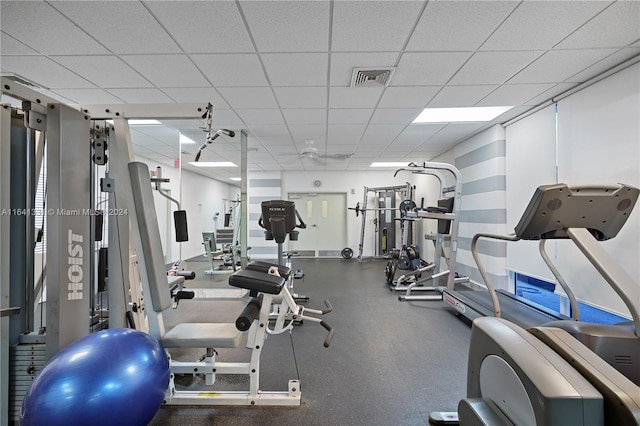 gym featuring a drop ceiling