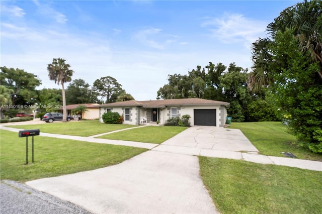 single story home featuring a garage and a front yard