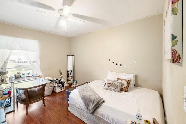 bedroom with ceiling fan and dark hardwood / wood-style floors