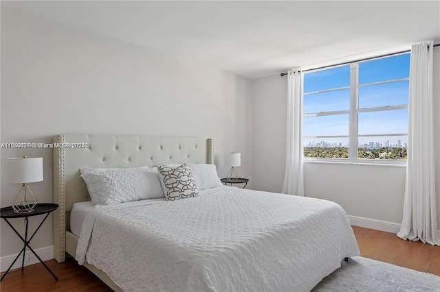 bedroom with wood-type flooring