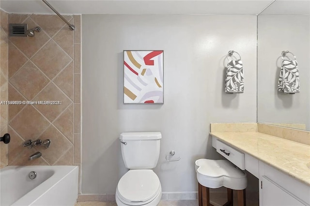 full bathroom with tile patterned floors, toilet, tiled shower / bath combo, and vanity