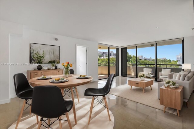 dining space featuring floor to ceiling windows