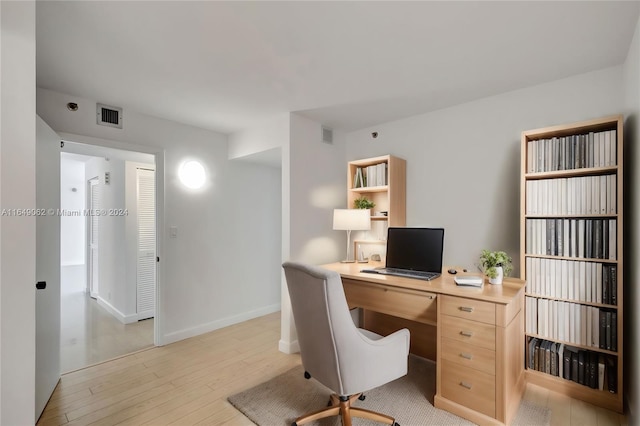 office area with light wood-type flooring