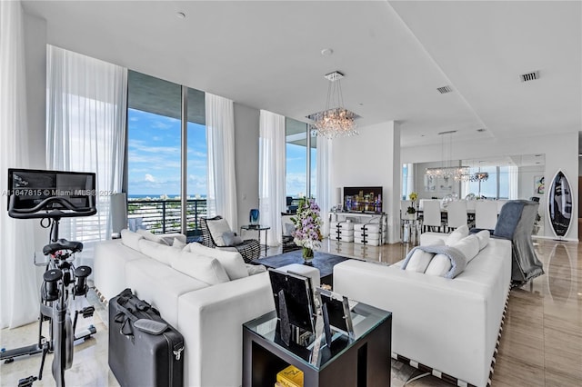 living room featuring a chandelier, floor to ceiling windows, light tile patterned floors, and a healthy amount of sunlight