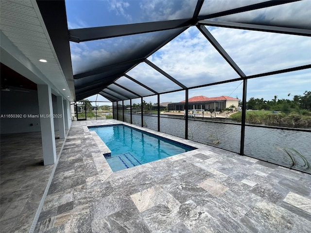 view of pool featuring a patio and glass enclosure