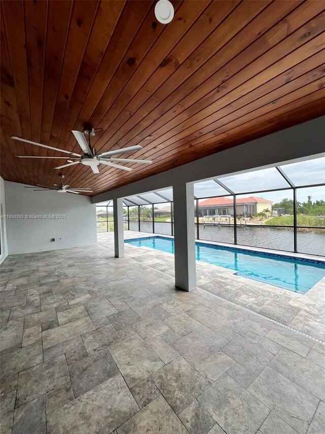 view of pool with a water view