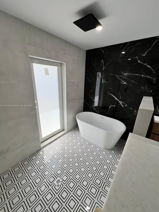 bathroom with separate shower and tub and tile walls