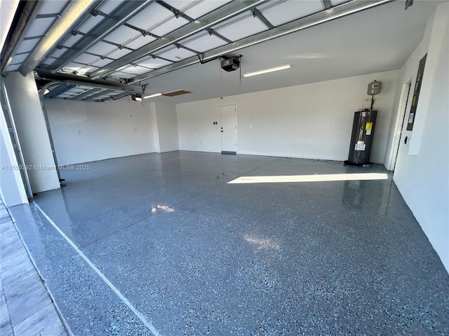 garage featuring a garage door opener and water heater