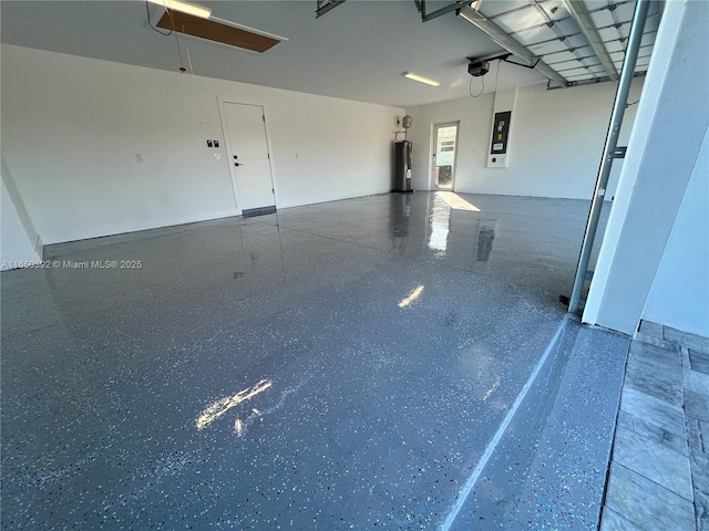 garage with water heater and electric panel