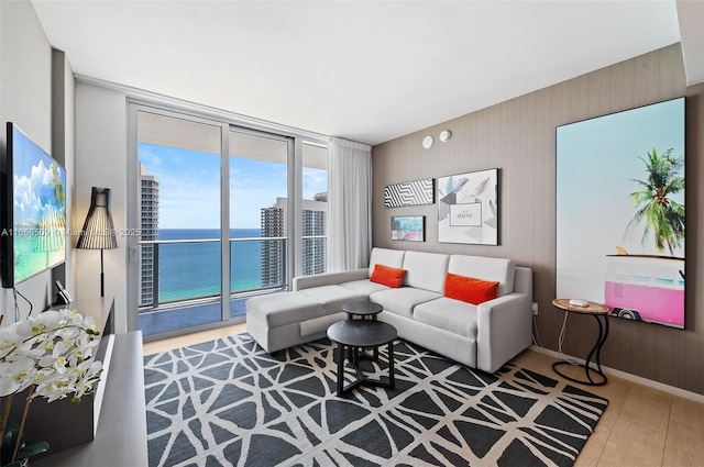 4010 S Ocean Dr Unit T3507, Hollywood, FL 33019 - living area featuring a water view, expansive windows, and baseboards