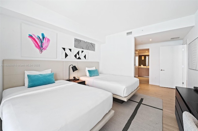 4010 S Ocean Dr Unit T3507, Hollywood, FL 33019 - bedroom featuring light wood-style flooring and ensuite bathroom