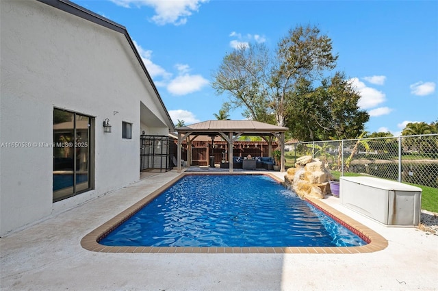 view of pool featuring an outdoor hangout area, a patio area, and a gazebo