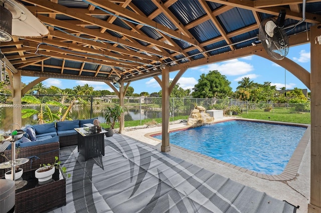 view of pool with a water view, an outdoor living space, and a patio area