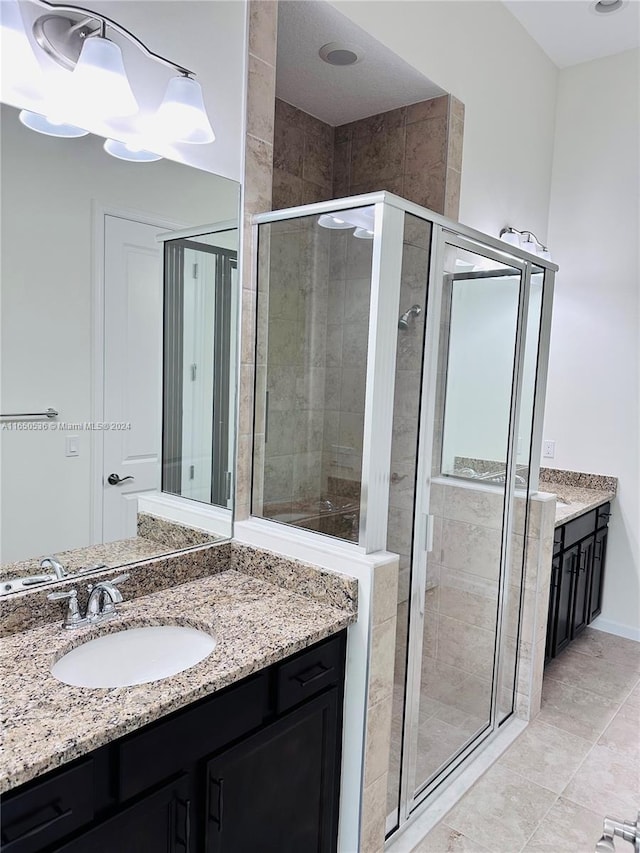 bathroom with vanity and an enclosed shower