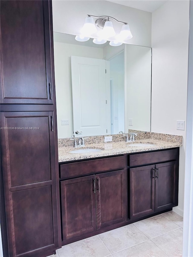 bathroom featuring tile patterned flooring and vanity