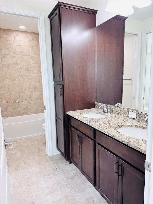 bathroom featuring vanity, toilet, and tile patterned flooring