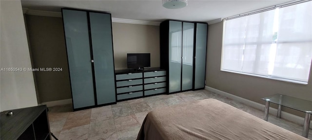 bedroom with crown molding