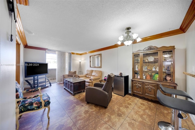 living room with tile patterned floors, ornamental molding, an inviting chandelier, and a textured ceiling