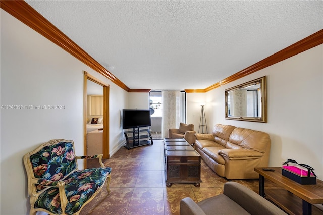 tiled living room with ornamental molding and a textured ceiling