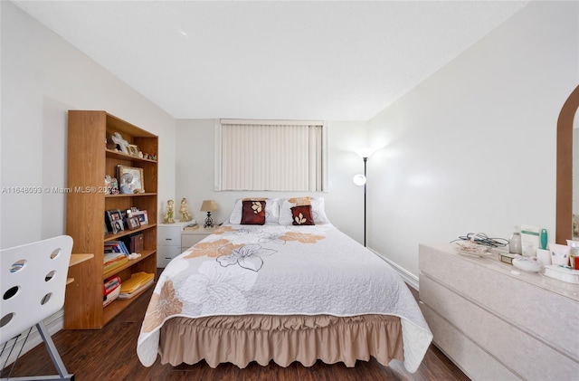 bedroom featuring dark hardwood / wood-style flooring