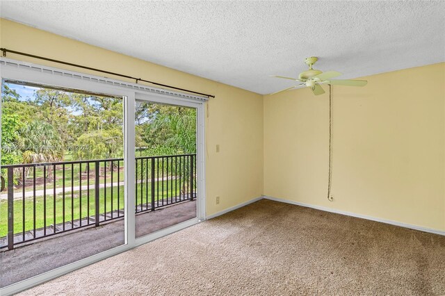 unfurnished bedroom featuring ensuite bath, a textured ceiling, ceiling fan, and carpet flooring