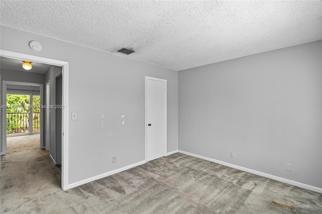 8145 Lagos De Campo Blvd Unit D-1, Tamarac, FL 33321 - empty room featuring carpet floors, a textured ceiling, and a smoke detector