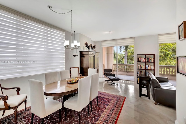 dining space with a notable chandelier