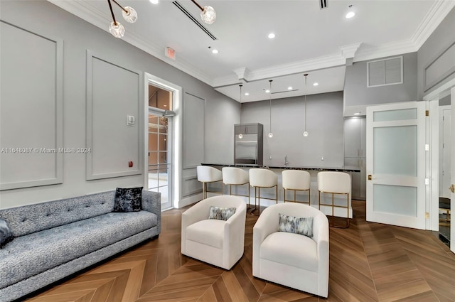 living room with parquet floors and ornamental molding