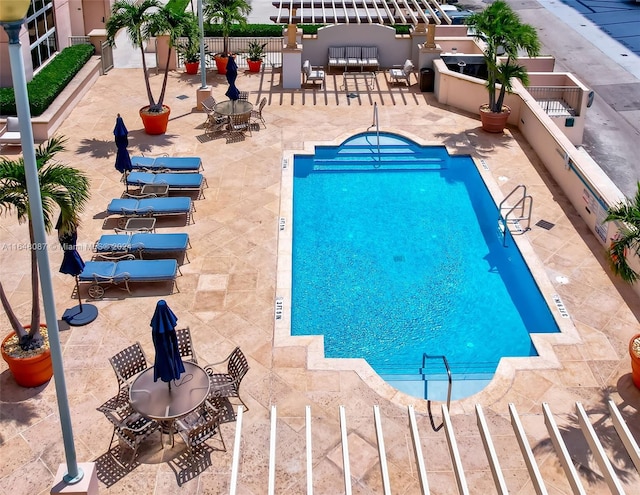 view of swimming pool with a patio