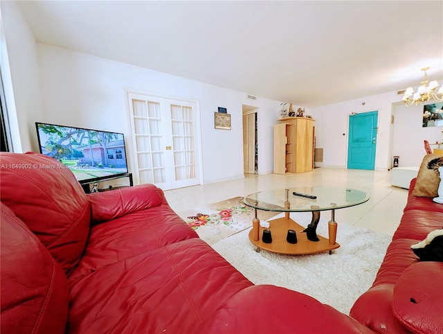 living room featuring an inviting chandelier and light tile patterned flooring