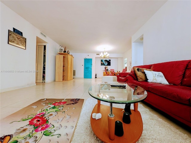 living room with an inviting chandelier and light tile patterned flooring