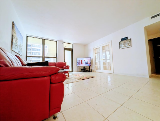 tiled living room with plenty of natural light