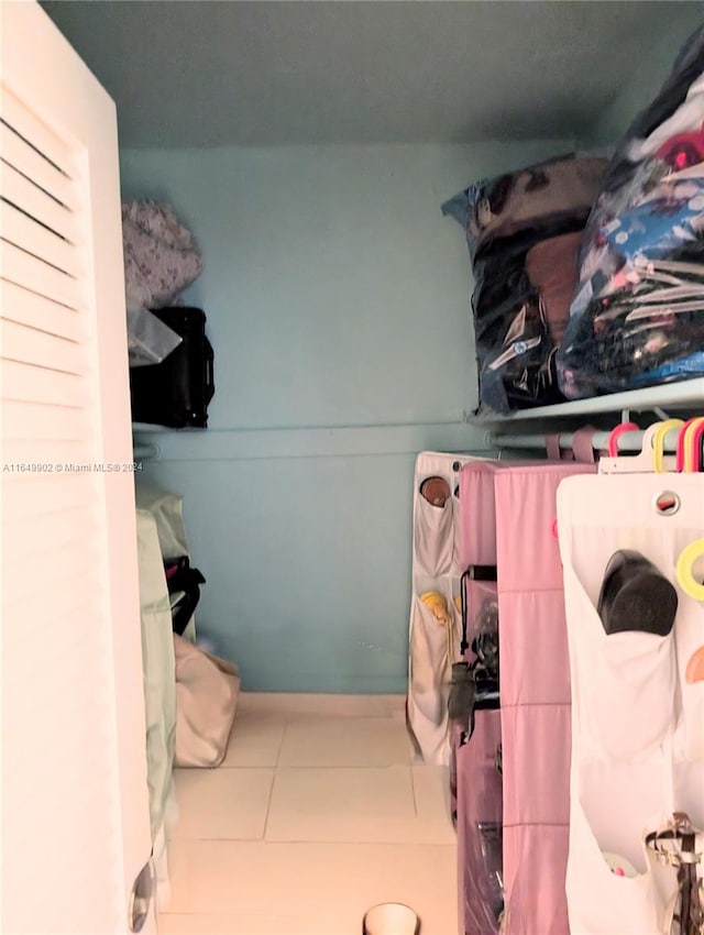 spacious closet featuring tile patterned floors